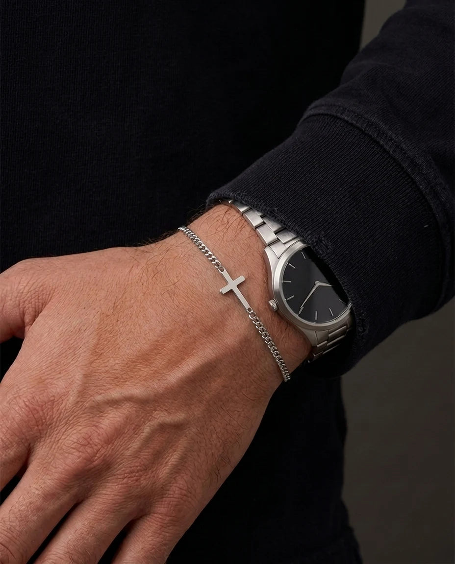 Silver Stellan bracelet worn beside a steel watch with a black dial